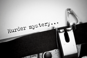 Murder mystery A black and white image of a typewriter that spells out the words "Murder mystery..." onto a piece of paper